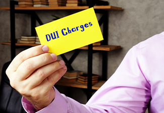 DUI Charges sign on the piece of paper