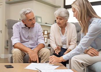 Senior couple preparing estate plan with attorney