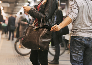 Thief stealing wallet at the subway station