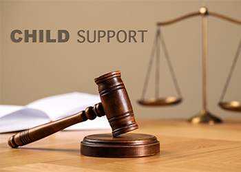 Judge's gavel, scales of justice and Child Support Word