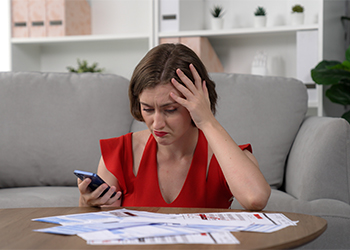 Stressed women due to financial problems and unpaid debt