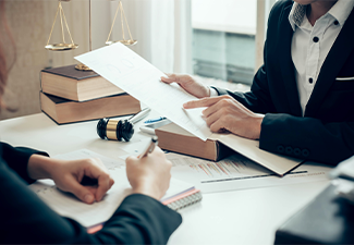 Businessman and lawyer discuss the bankruptcy document