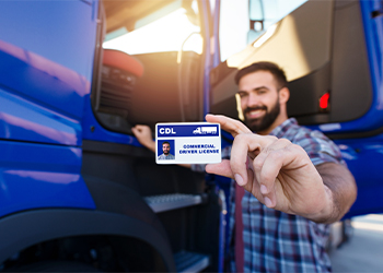 Truck driver showing his Commercial Driver's License