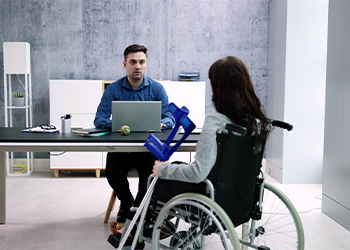 Disabled women in wheelchair visiting attorney