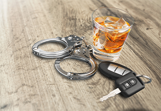 Whiskey with car keys and handcuffs 