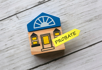 Wooden house and sticky note written with Probate