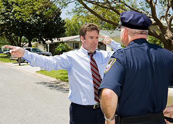 Police taking field sobriety test of a man