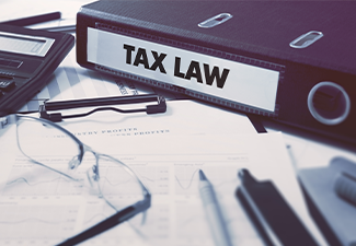 Office folder with inscription Tax Law