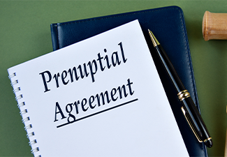 PRENUPTIAL AGREEMENT- words on a white sheet with a judge's gavel