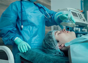 Medical worker giving general anesthesia to the patient