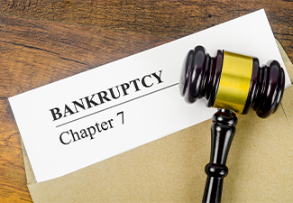 The Bankcrupty Chapter 7 text on Document form and Wooden Gavel