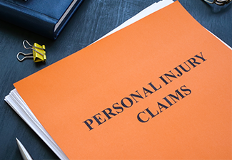 A stack of papers with personal injury claims on the table