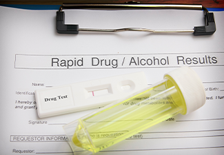 Drug test blank form with test kit and urine,focus on paper