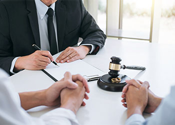 Couples with attorney preparing Divorce Papers