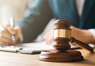 Male judge doing report papers in courtroom, fair trial
