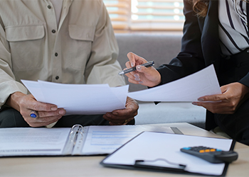 Elderly women preparing estate plan with attorney