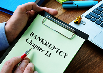 Bankruptcy Chapter 13 words written in notepad