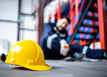 Injured factory worker in pain