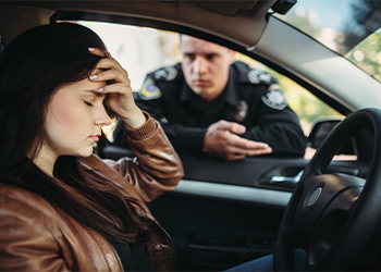 Male cop in uniform asks for female driver documents
