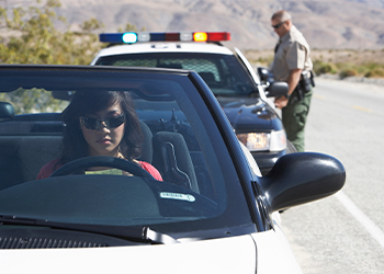 Female driver pulled over by police in highway