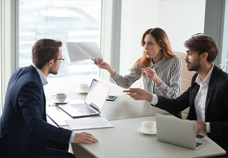 Diverse business partners disagree with company CEO on contract terms