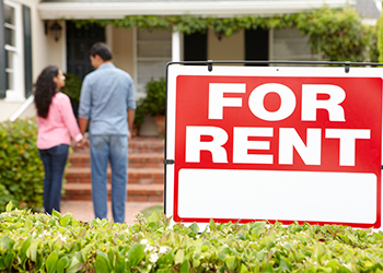 Couple outside home for rent