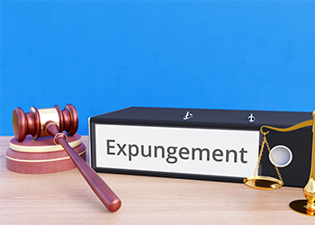Folder with labeling Expungement, gavel and justice scale