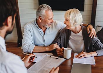 Senior couples preparing estate plan with help of attorney