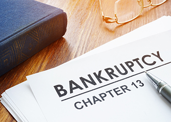 Bankruptcy Chapter 13 document and pen