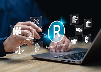 Registred Trademark word and related icons on laptop screen