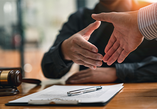 Lawyers shake hands with business people to seal a deal