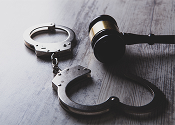 Gvael and Handcuff on table