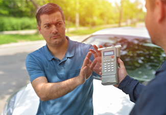 Driver due to being subject to test for alcohol content with use of breathalyzer