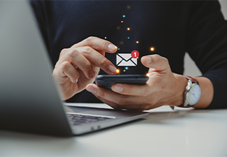 Hand of person using smartphone for text message