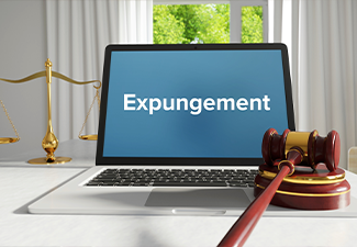 Expungement – Law, Judgment, Web. Laptop in the office