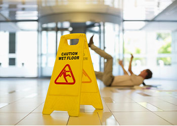 Man slips and falls on wet floor inside shopping mall
