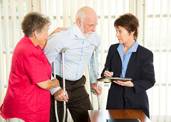 Injured person and his wife with personal injury lawyer