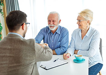 Old couples preparing estate plan with the help of attorney