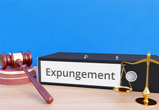 Expungement – Folder with labeling, gavel and libra – law, judgement, lawyer