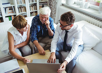 Senior couple preparing estate plan with help of attorney