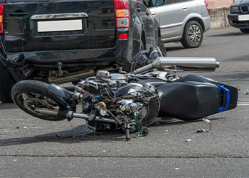 Crashed Motorcycle in road after accident