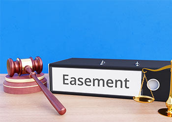 Easement file folder with gavel and scale of justice