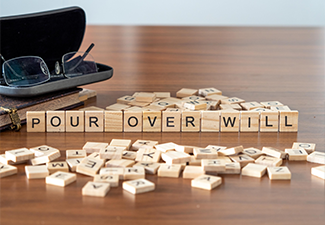 pour over will word or concept represented by wooden letter tiles