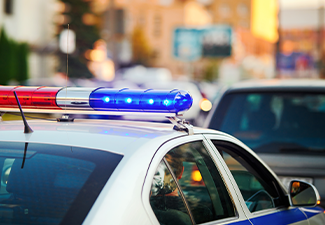Blue and red light flasher on top of police car