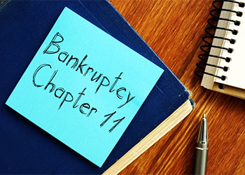 Bankruptcy Chapter 11 words in sticky note