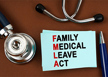 Pen,Stethoscope and note with FMLA Word