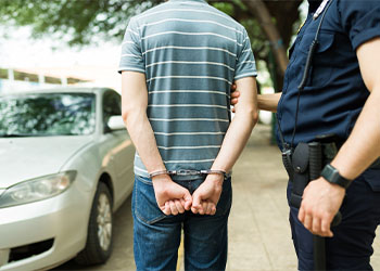 Police arresting a young man