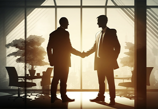 Silhouette of business man handshake inside a office building