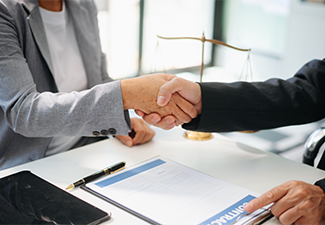 Woman lawyer hand and women client shaking hand collaborate