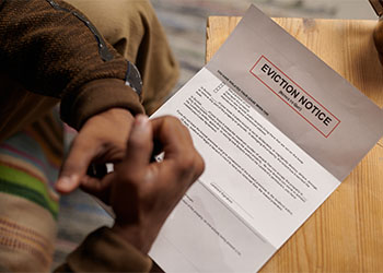 Person reading eviction notice